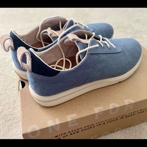 COPY - Tom’s textured blue sneakers with leather trim.